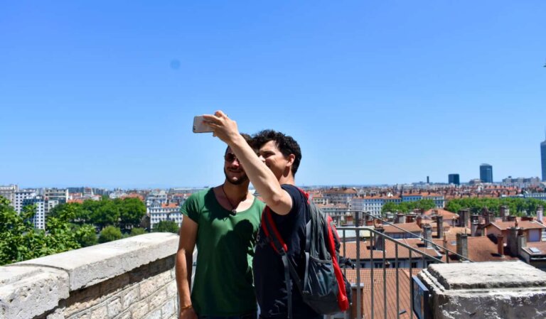 Nomadic Matt posing for a photo with his host in France