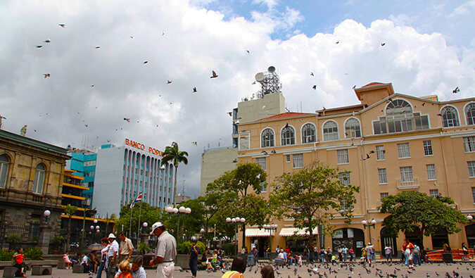 San Jose Square in Costa Rica. People, birds, and shops.