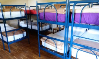 Bunk beds in an empty dorm in a hostel