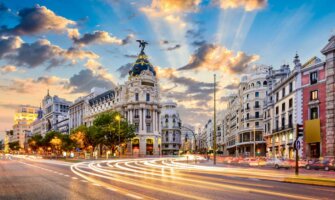 A long exposure shot of Madrid, Spain with cars blurring by in the evening