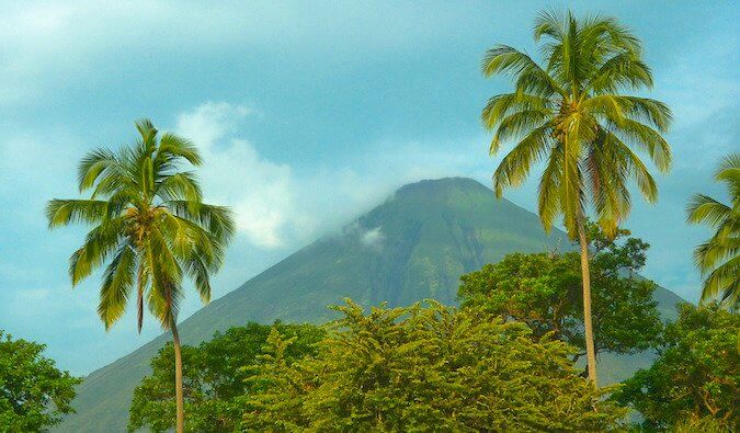 volcano in Nicaragua. palm tree in the foreground