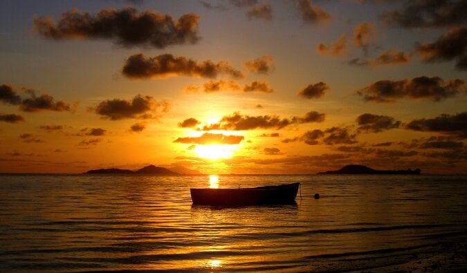 boat in water during sunset