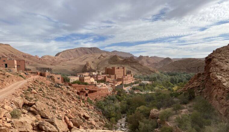 ust red villages along a dusty road in Dades Valley, Morocco