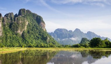 A karst mountain near the water in Vang Vieng, Laos