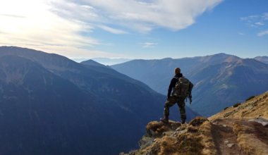A solo traveler hiking in the mountains