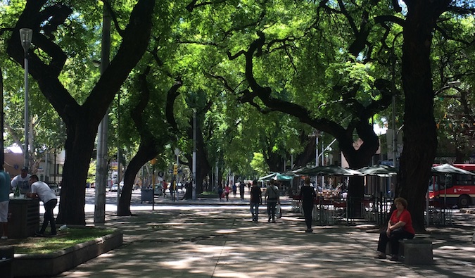 People walking down a boulevard in Buenos Aires, Argentina