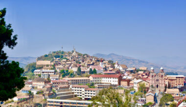 The sweeping view of a city in Madagascar with hills in the background