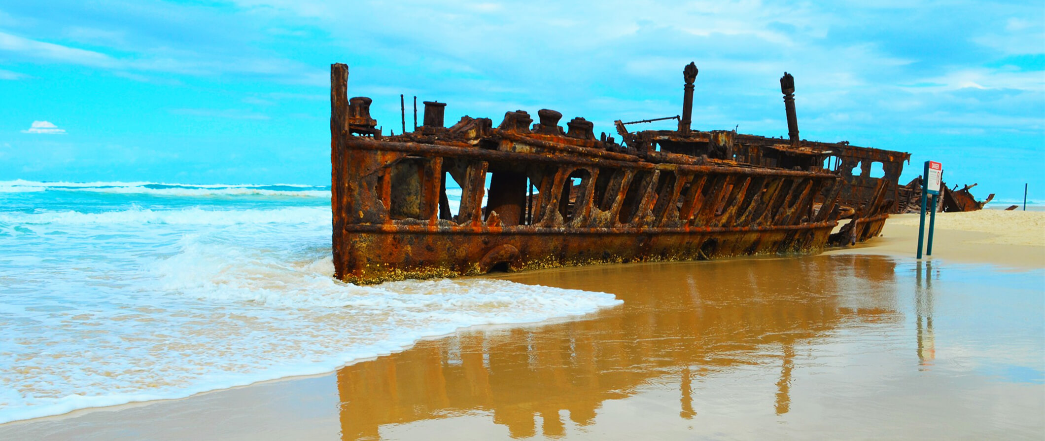an abandoned shipwreck on the beach on Fraser Island in Australia