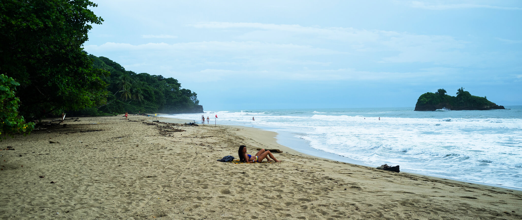 Woman sunbathing on the beach in Puerto Viejo, Costa Rica
