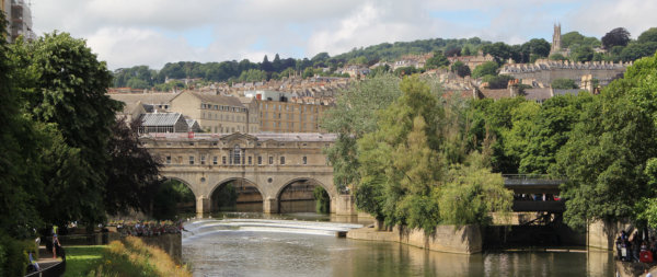 View of the river in Bath, England, looking towards the bridge