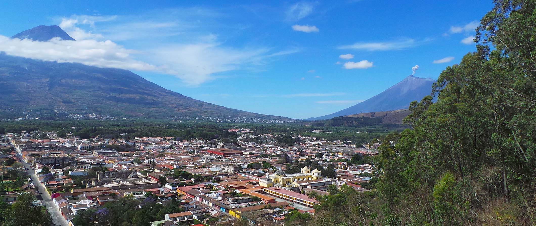 Antigua Guatemala with a view of Volcan Agua to the left and Fuego to the right