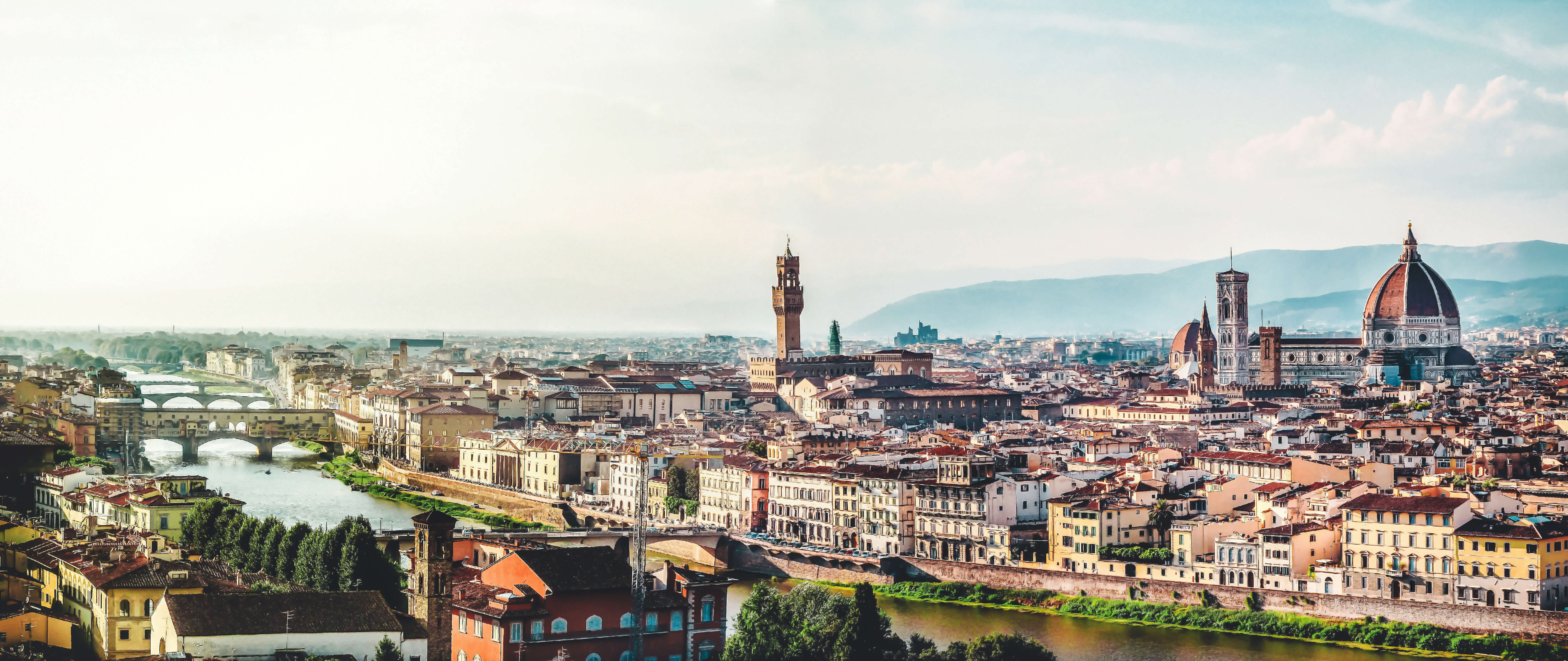 view of an Italian city with a river running through