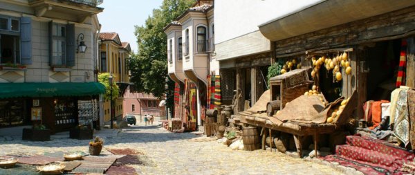 Plovdiv Guild - Plovdiv street view, cobbled street, houses, and shops