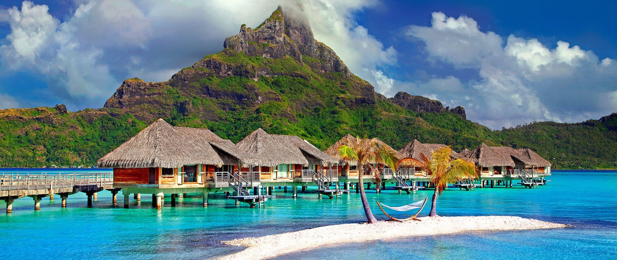 houses on stilts over the sea in Polynesia