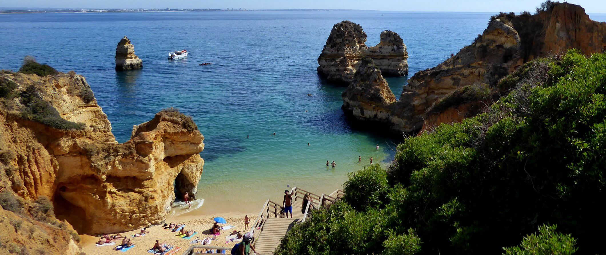 a beach with people sunbathing in Lagos