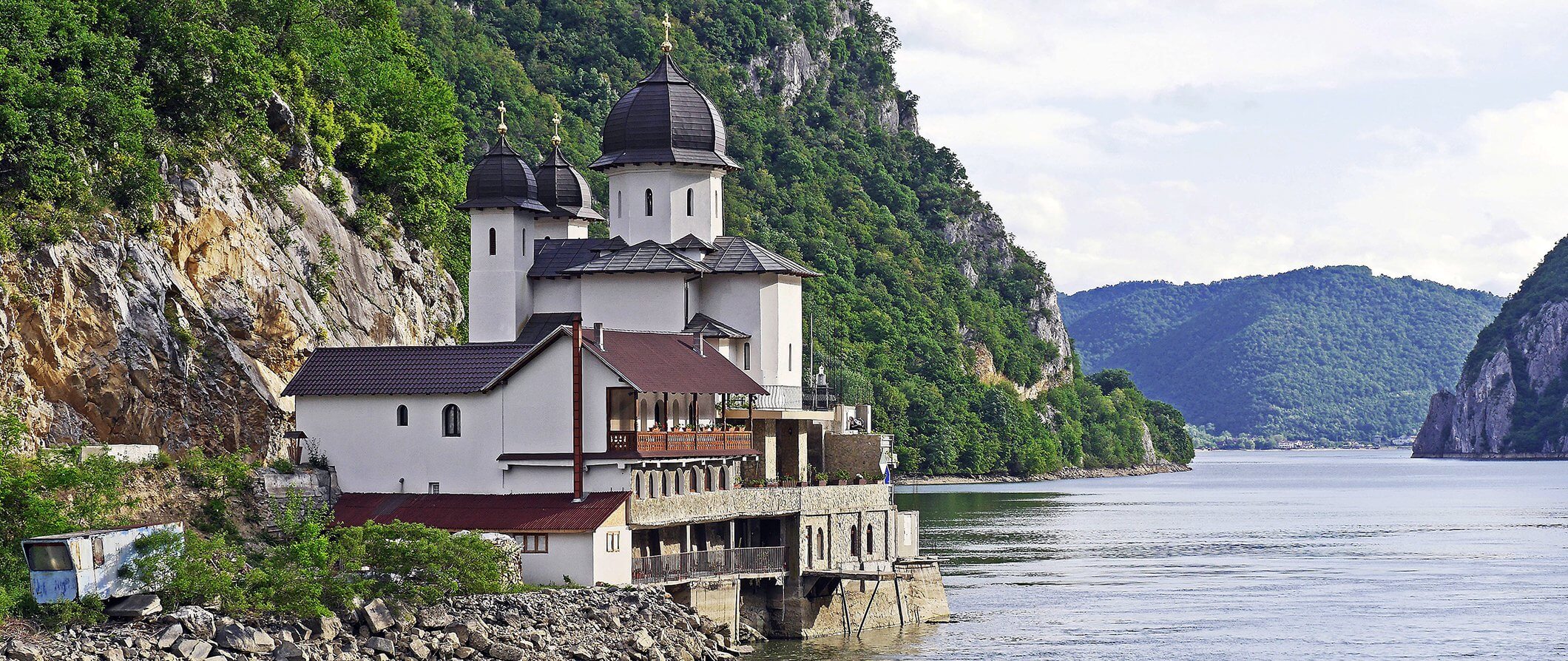 traditional Romanian house situated on a riverbank