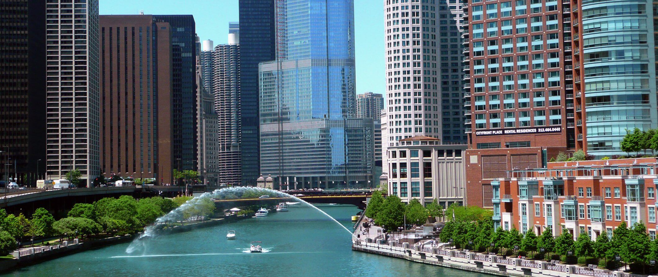 city view of Chicago. River running through the center of image with tall buildings either side.