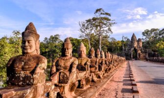 Iconic statues lining the road to Angkor Wat in beautiful Cambodia