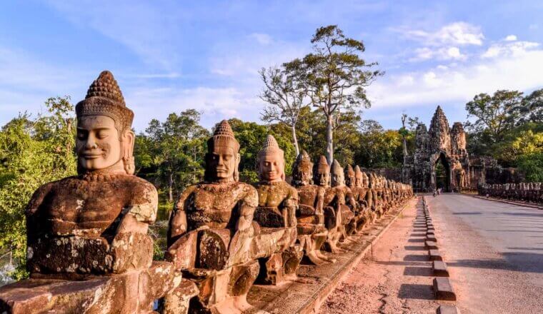 Iconic statues lining the road to Angkor Wat in beautiful Cambodia