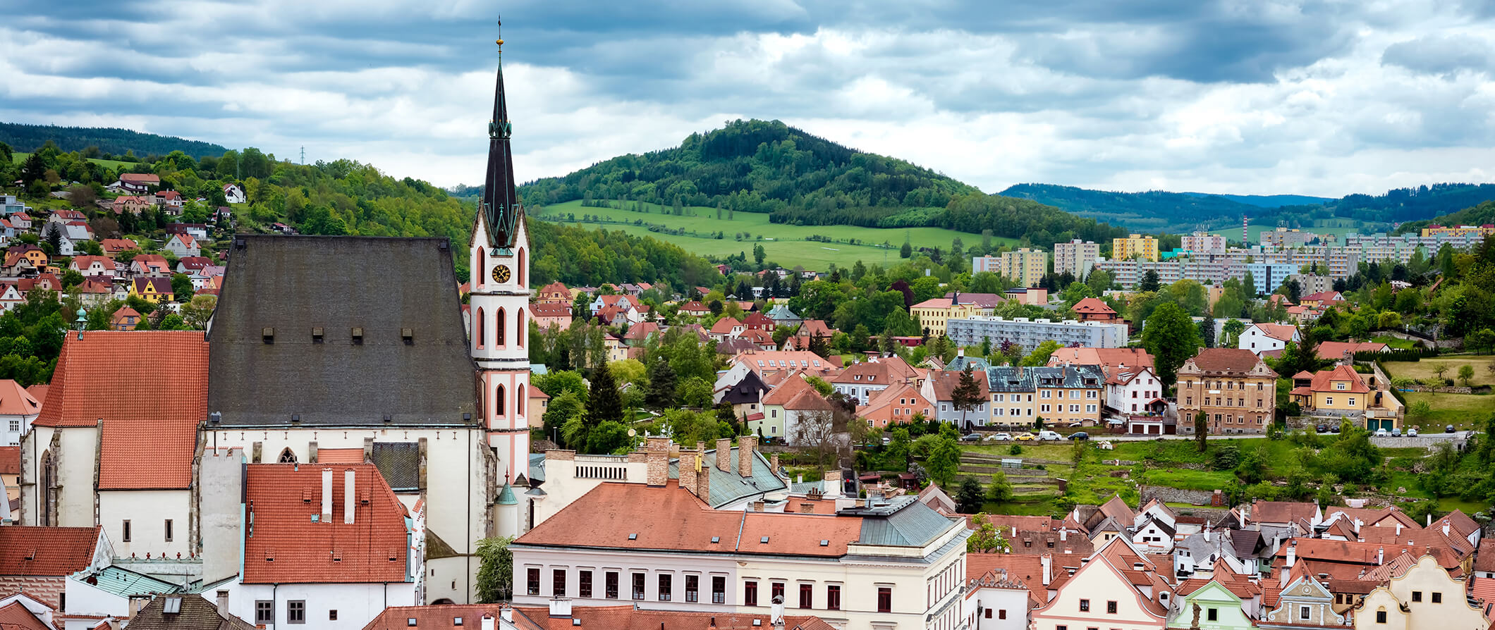 areal view of a town in Czech republic green hills in the background