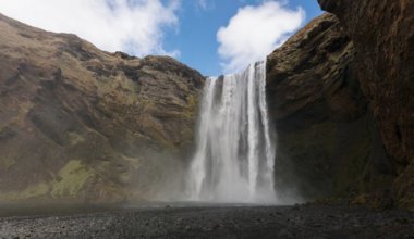 Skogafoss waterfall in Iceland on a bright summer day