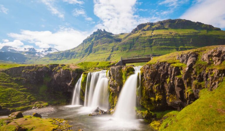 A beautiful waterfall in sunny, rugged Iceland