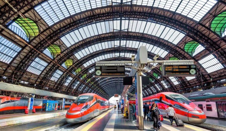 High speed trains waiting for departure on platforms at the train station in Milan, Italy