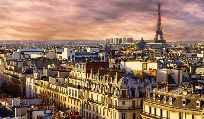 sunset over the Eiffel Tower and the rooftops of Paris