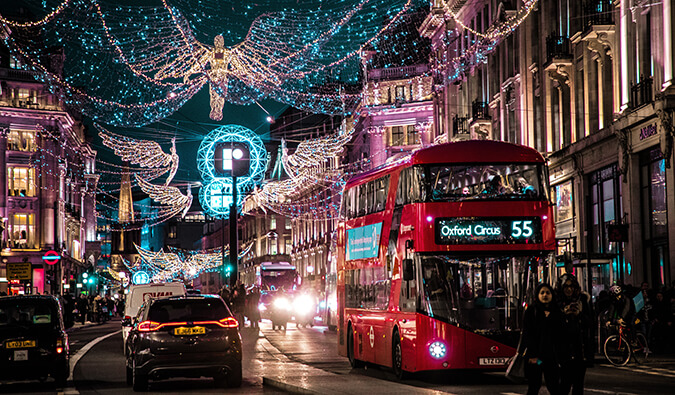 london lights during the holiday season with an iconic red bus