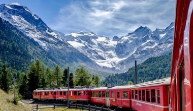 A train speeding through the mountains of Switzerland