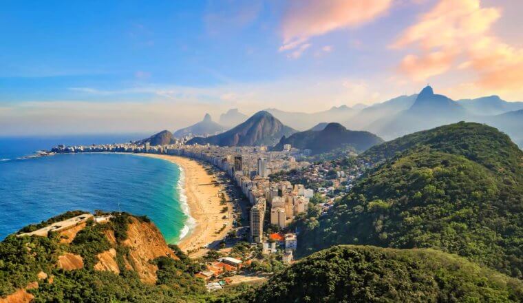 The stunning view overlooking the city of Rio in Brazil with lush, rolling mountains in the background