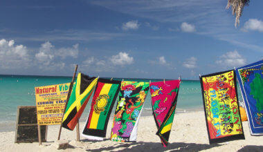 beach towels hanging on a line at a beach in Jamaica