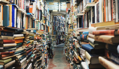 a hallway of colorful stacked books