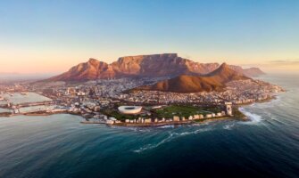A beautiful aerial view overlooking the coastal city of Cape Town, South Africa at sun down.