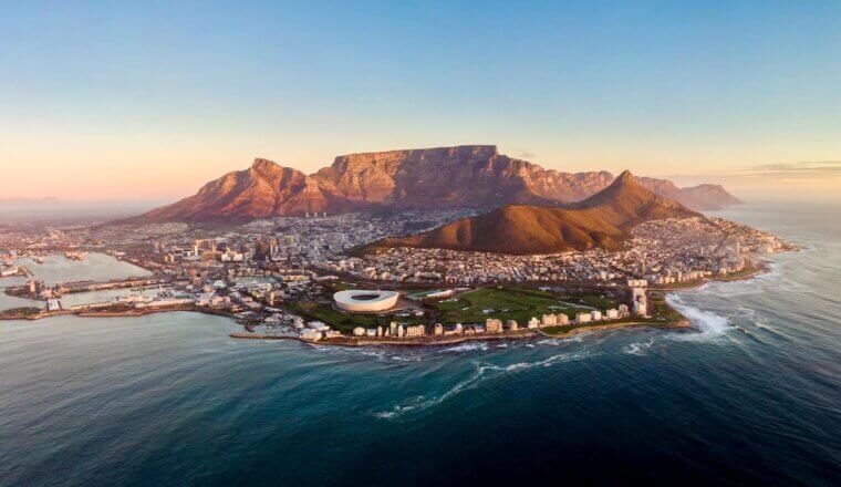 A beautiful aerial view overlooking the coastal city of Cape Town, South Africa at sun down.