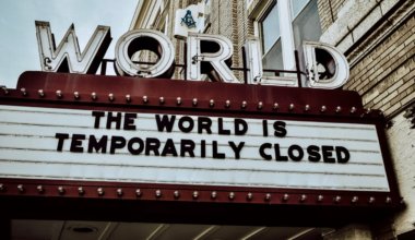 A movie theater billboard saying the world is closed