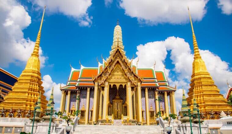 One of the many beautiful and colorful temples in Bangkok, Thailand on a bright and sunny day