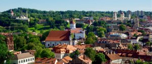 The colorful and historic buildings of Lithuania surrounded by forests
