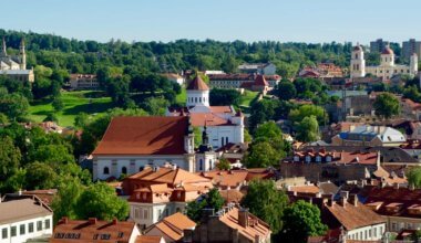 The colorful and historic buildings of Lithuania surrounded by forests