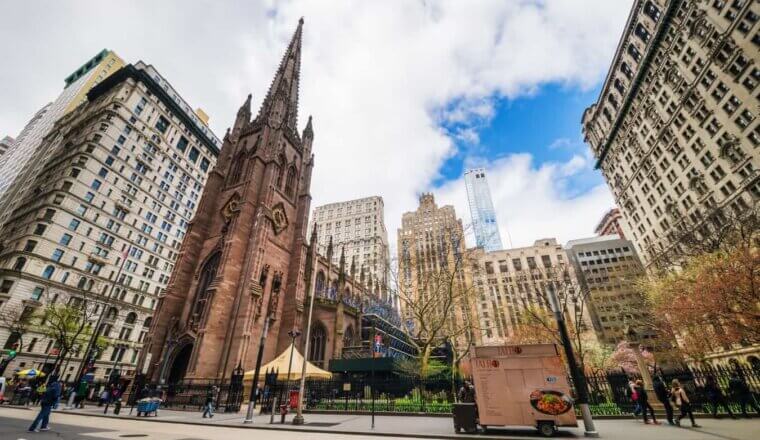 A wide-angle shot of Trinity Church in New York City, USA
