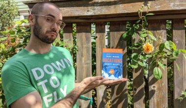 good travel apps Scott Keyes from Scott's Cheap Flights holding his new book