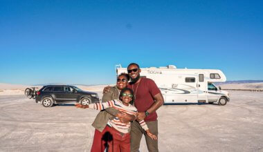 Karen from MOM Trotter with her family and her RV in the desert