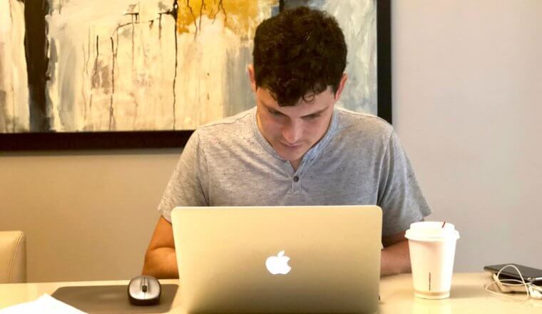 Nomadic Matt working at a laptop as a digital nomad