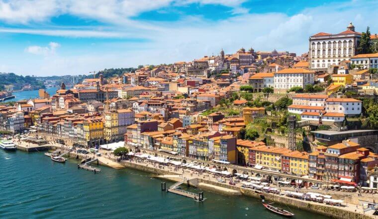 Porto, Portugal and its hillside colorful buildings as seen from the Douro River