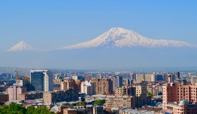 skyline of Yerevan, Armenia with a snow-capped mountain in the background