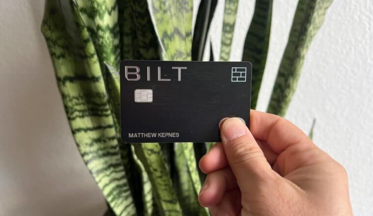 Matt's Bilt Rewards Mastercard being held up in front of a snake plant