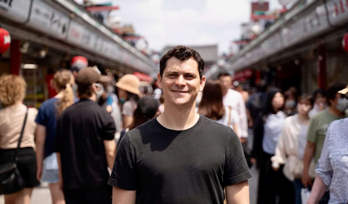 Nomadic Matt standing in a huge crowd of tourists in sunny Japan