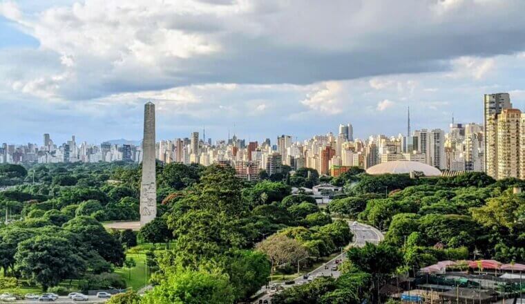 São Paulo ciy skyline with the obelisk and Ibirapuera Park in the foreground and the skyscrapers of the city in the background