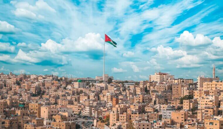 A bright blue sky over Amman, Jordan with a sky blowing in the wind