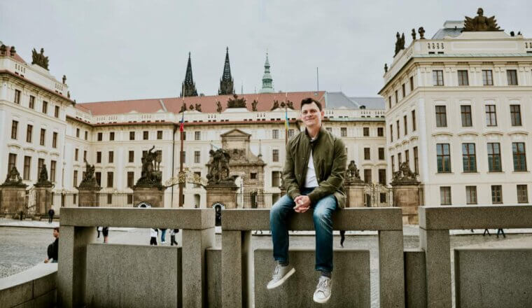 Nomadic Matt posing for a photo in historic Prague, Czechia